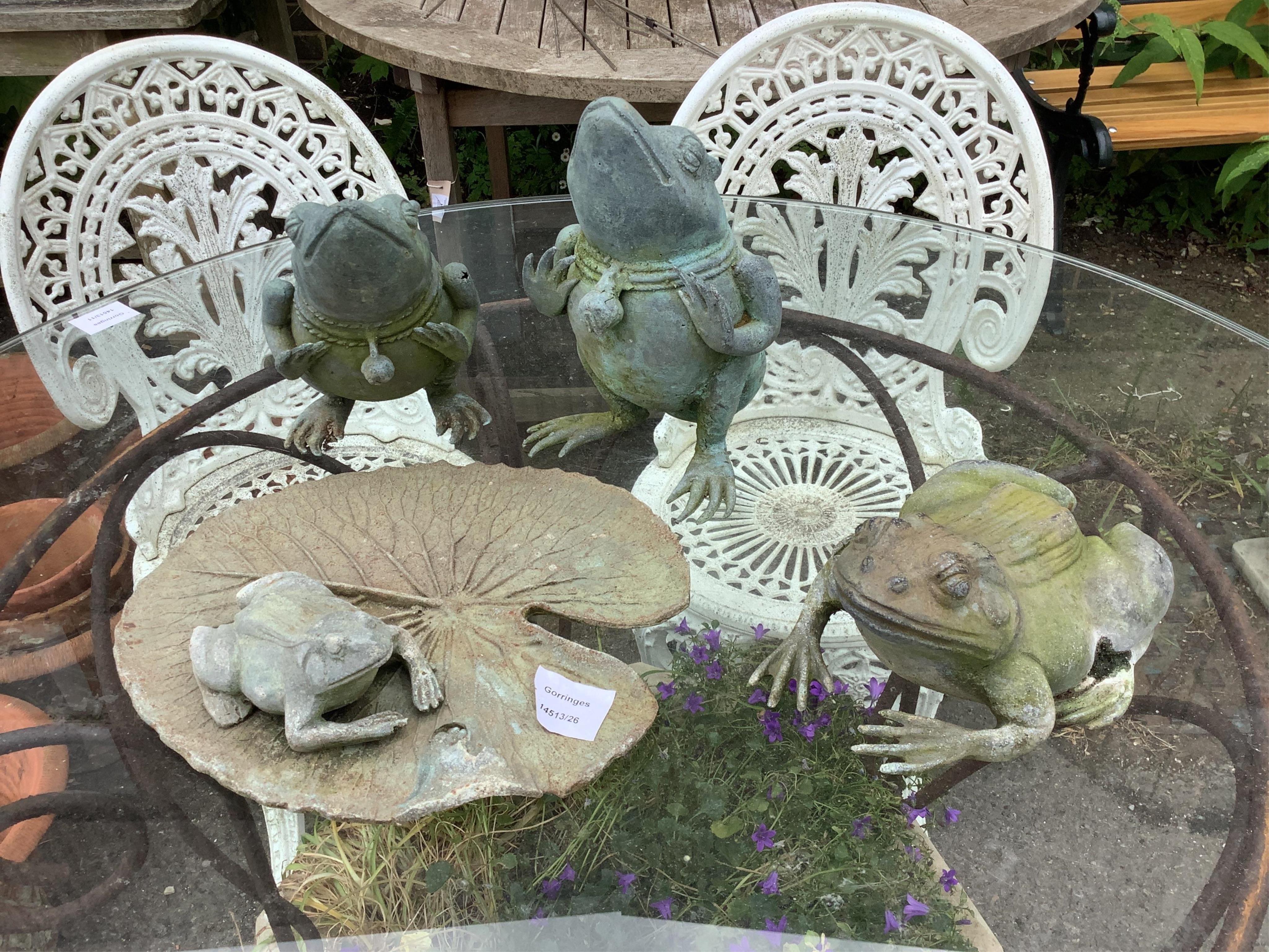 Four metal frog garden ornaments, largest height 22cm. Condition - good
